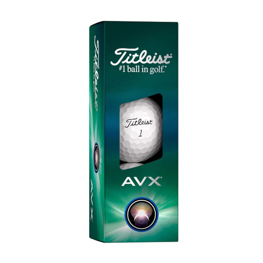 A green and white cardboard box containing Titleist AVX golf balls, featuring a logo and a window showing one ball.