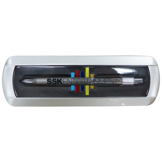 A matte metal gift box containing a silver pen, featuring a logo and colourful design elements.