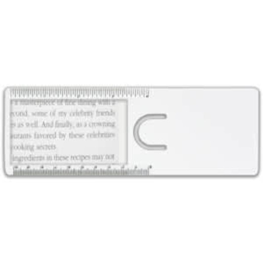 A clear magnifier ruler features a rounded cut-out and printed measurement markings, ideal for reading and measuring.
