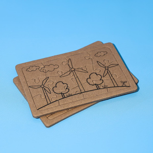 A jigsaw puzzle set featuring two puzzles with wind turbines and trees, made of brown cardboard.