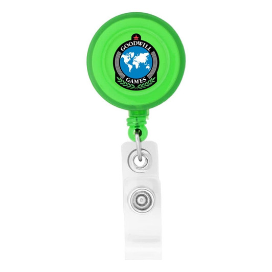 A green round badge holder with a retractable cord and a clear attachment clip, featuring a logo on its front.