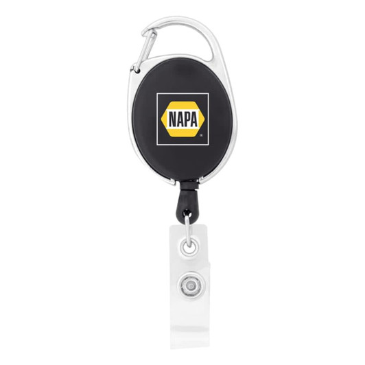 A retractable badge holder in black with a silver clip and clear strap, featuring a logo on the front.