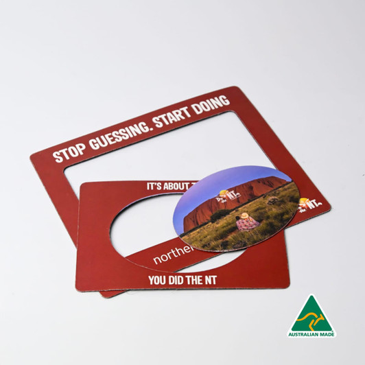 A magnetic photo frame set in a rich red colour, featuring a circular insert and a logo.