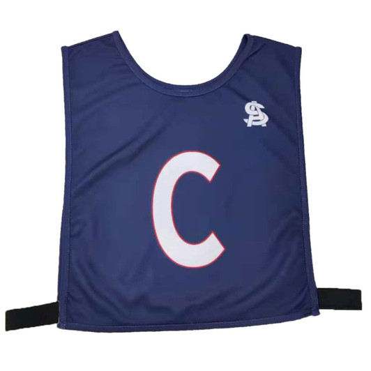 A navy netball bib featuring the letter 'C' in white, with a logo on the upper left. Elastic straps included.