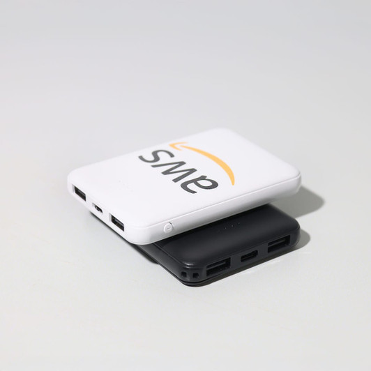 A white and black powerbank stacked together, featuring a logo and multiple USB ports.