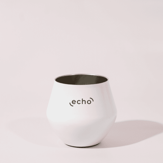A white, detachable wine glass with a sleek design and a logo on the front.