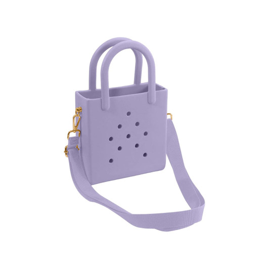 A mini beach bag in lavender with handles and a detachable strap, featuring holes and a simple design.