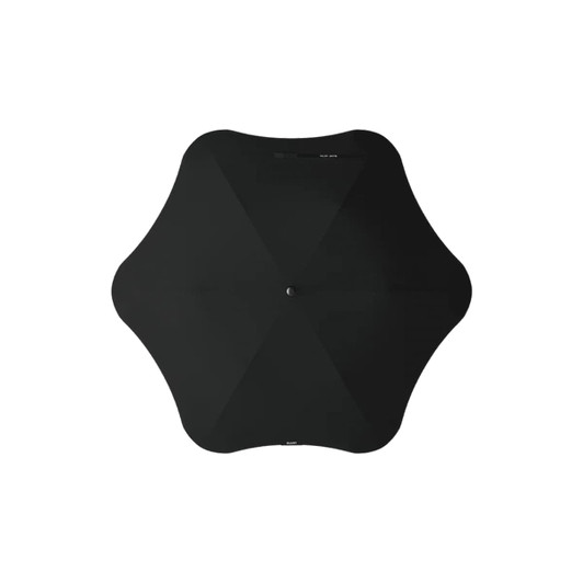 A black BLUNT Metro Umbrella with a unique shape and central button. It features a minimalist design.