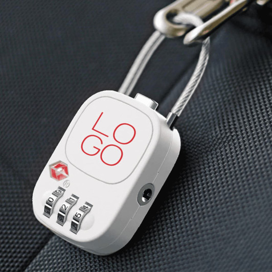 A white TSA lock with a combination dial attached to a travel bag, featuring a logo on the front.