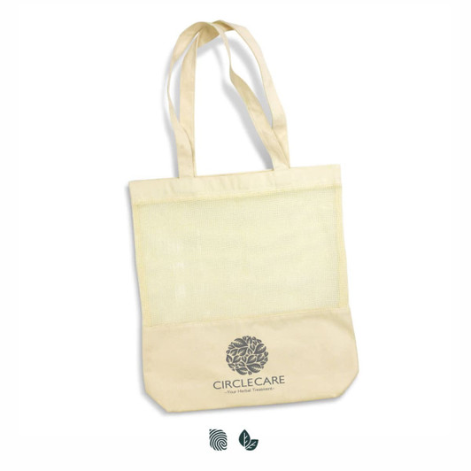 A cream cotton tote bag featuring a mesh panel and a logo on the lower section. It has two shoulder straps.