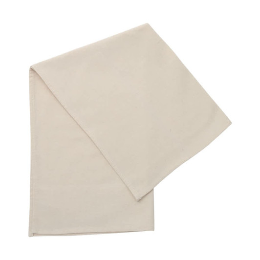 A cotton tea towel in a plain cream colour, neatly folded. It features a small logo in one corner.