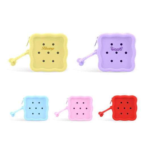 A square silicone pouch in yellow, purple, blue, pink, and red, with dotted holes and a handle. It features logos.