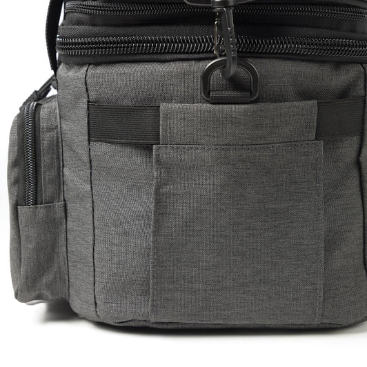 A grey expanding cooler with multiple pockets and zippers, featuring a sleek design and a black trim.