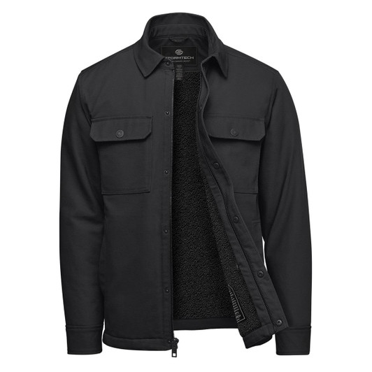 A black men's jacket with a sherpa lining, featuring buttoned chest pockets and a zip front. It has a logo on the inside.