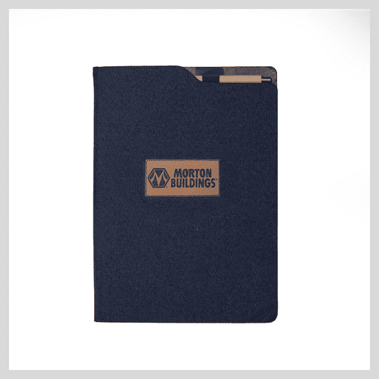 A navy notebook with a textured cover and a brand logo in the centre. Features an exterior pocket.
