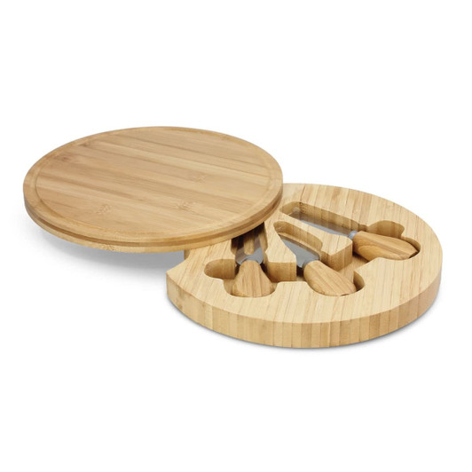 A round bamboo cheese board with a removable section containing cheese knives.