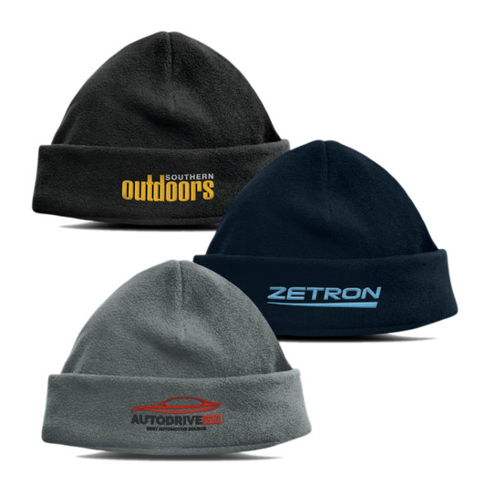 A trio of Seattle polar fleece beanies in grey, dark blue, and black, featuring various logos.