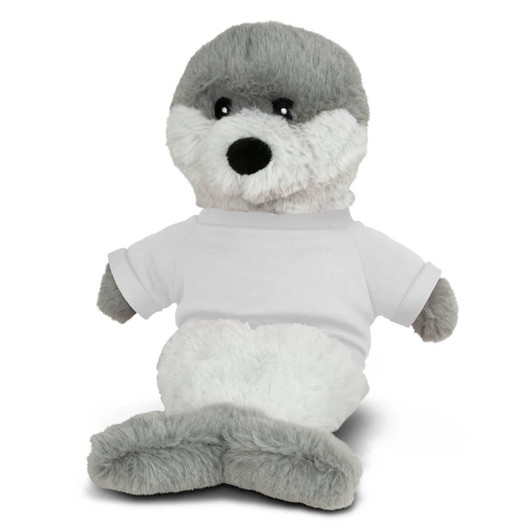 A plush seal toy in grey and white, wearing a plain white T-shirt. It has a friendly expression and soft fur.
