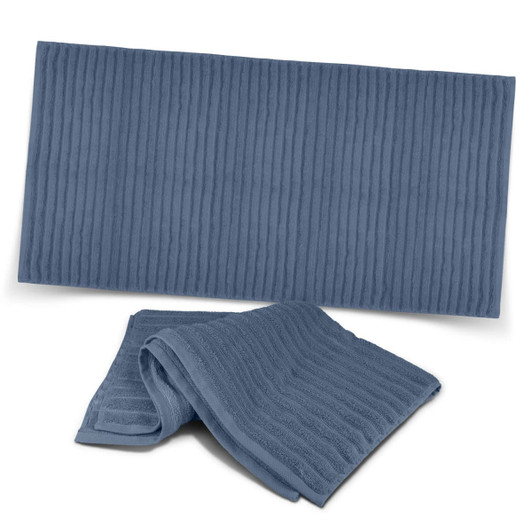 A dark blue luxury towel with a ribbed texture, featuring one folded towel and one flat towel below it.
