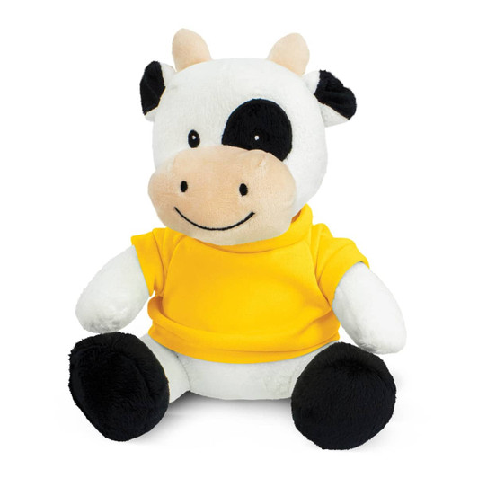 A cow plush toy with black and white fur, wearing a yellow shirt, sitting upright with a friendly smile.
