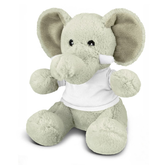 A grey elephant plush toy with large ears, wearing a white shirt, sitting on a flat surface.