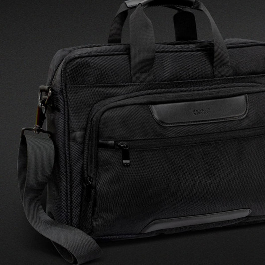 A black Swiss Peak Voyager Laptop Bag featuring multiple compartments and a detachable shoulder strap.