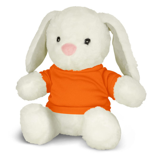 A soft, plush white rabbit toy wearing an orange shirt, with floppy ears and a pink nose. It has a logo on the shirt.