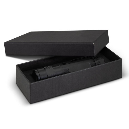 A black torch presented in an open black box, featuring a sleek design and a clip for attachment.