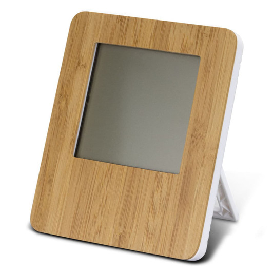 A bamboo-framed weather station with a sleek design and a grey screen, standing on a foldable white support.