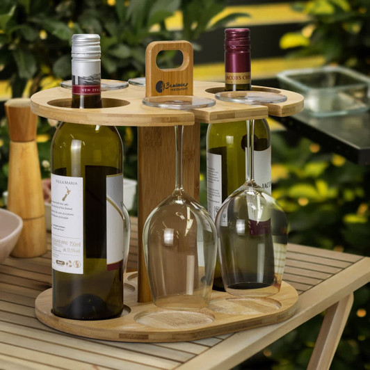 A bamboo wine rack holding two bottles of wine and two wine glasses, featuring a natural wood finish.