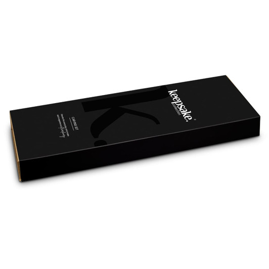 A black packaging box for the Keepsake Carving Set, featuring a logo and a sleek, modern design.