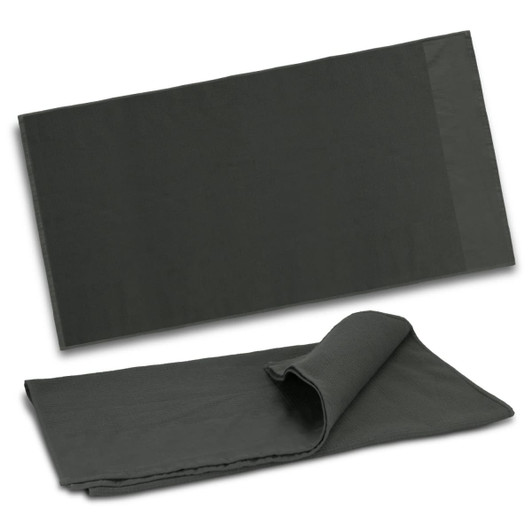 A dark green waffle towel, featuring a textured surface, folded and laid flat. Includes a logo detail.