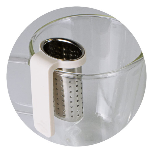 A glass cup with a white handle and a stainless steel infuser attached, designed for loose tea brewing.