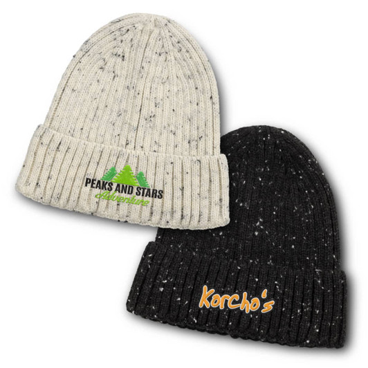 A snowflake beanie, featuring a cream and black colour scheme, with logos on the front of each hat.