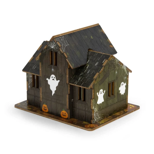 A wooden model of a spooky house featuring ghosts, cobwebs, and pumpkins, primarily in shades of brown and green.