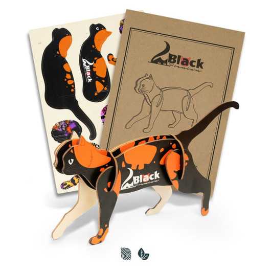 A wooden model of a cat in black and orange, with assembly parts and packaging included.