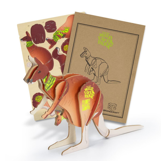 A wooden kangaroo model featuring brown tones and a box with colourful designs. It has a logo on the packaging.