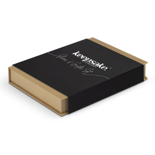 A black box with a gold base, featuring the Keepsake logo, containing kitchen slicer and grater utensils.