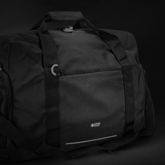 A black duffle bag with sturdy handles, featuring a front pocket and a logo.