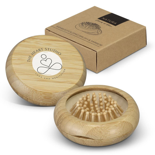 A bamboo brush and mirror set in a round case, accompanied by a brown outer box with a logo.