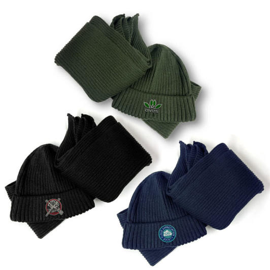 A set of knitted beanies in dark green, black, and navy, featuring various logos.