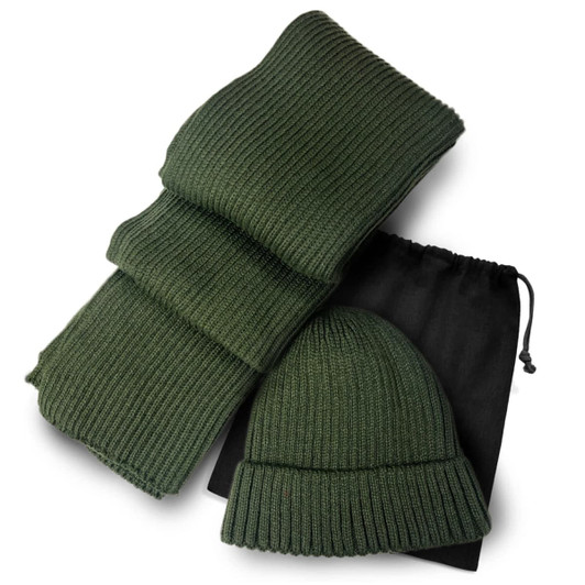 A green ribbed scarf and matching beanie set, neatly arranged with a black drawstring bag.