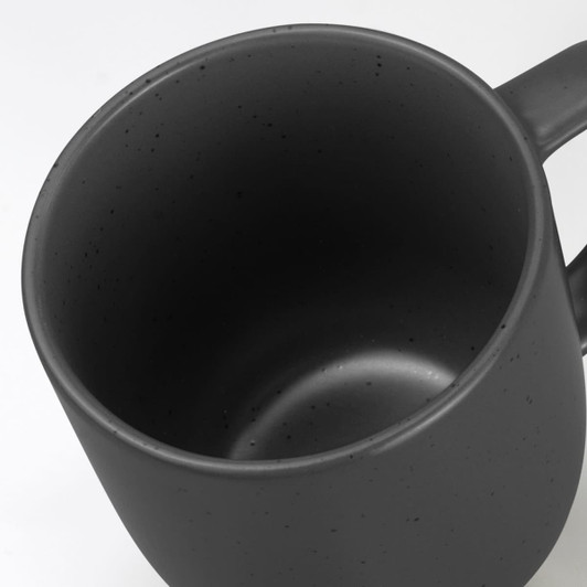 A black ceramic mug with a matte finish features a smooth interior and a simple design. It has a logo on the side.