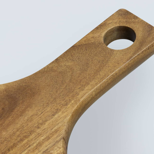 A wooden pizza board with a smooth finish and a circular hole in the handle.