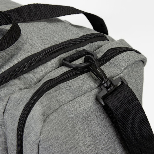 A grey duffle bag featuring a zip closure and a black strap for easy carrying.