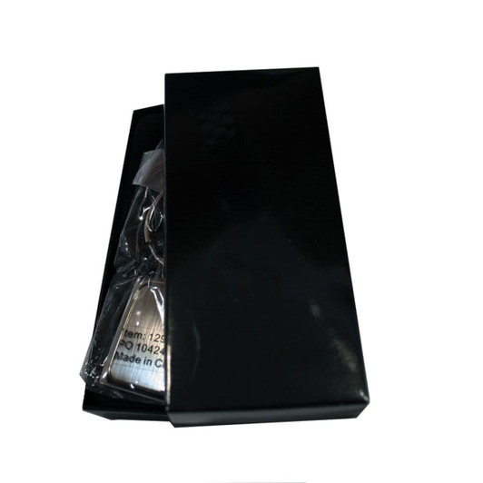 A rectangle keyring in a black box, featuring a sleek design. The packaging is glossy with a minimalist appearance.