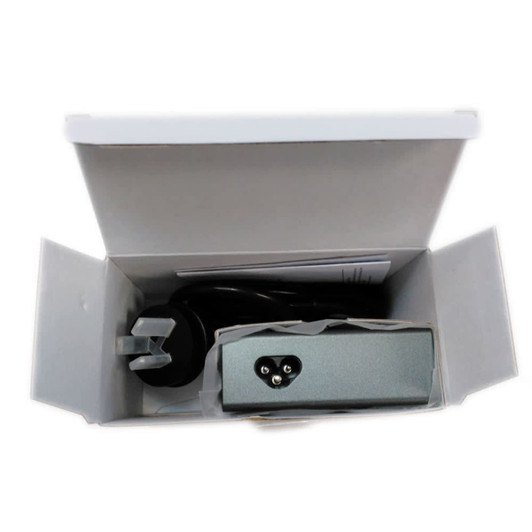 A USB smart charger in a grey casing, packed inside a white box with a plug and cables visible.