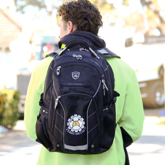 A black High Sierra Elite Fly-By 17" 42L computer backpack with a logo, worn by a person facing away.
