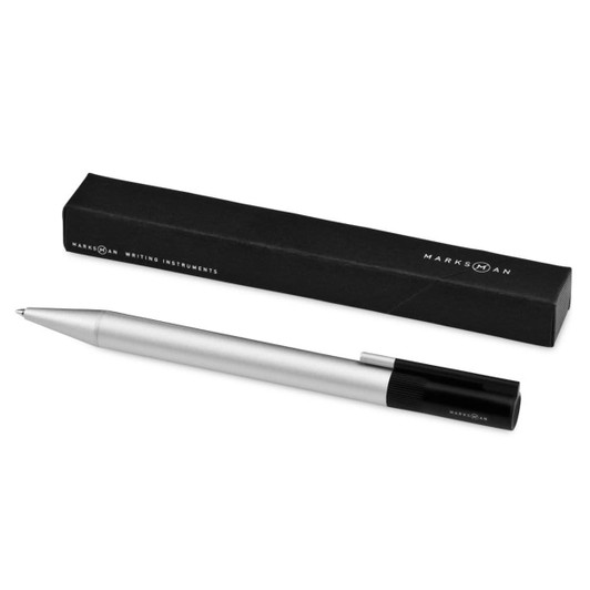 A silver ballpoint pen with a black cap, placed next to its black packaging. It features a logo on the pen.