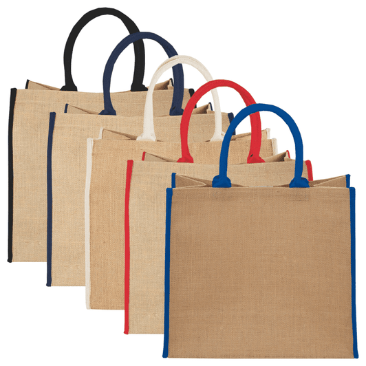 A collection of large jute tote bags in natural beige with contrasting coloured handles: black, navy, cream, and red.